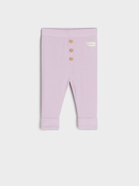 Purple baby leggings with buttons on a white background