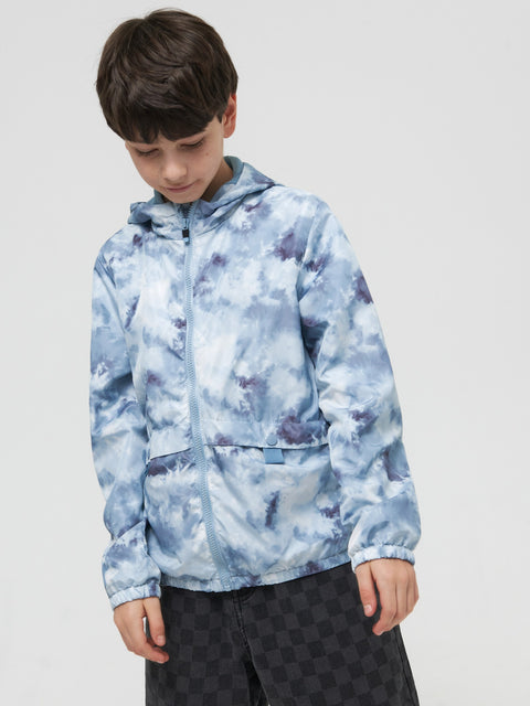 Child wearing a blue tie-dye hoodie on a plain background