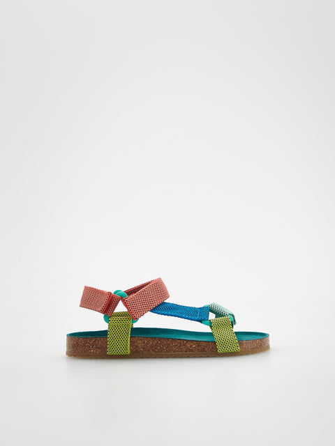 Colorful sandal with pink and blue straps on a white background