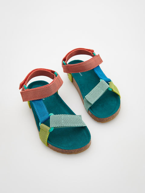 Colorful children's sandals on a white background