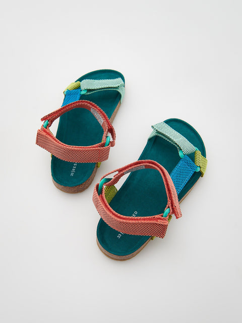 Pair of colorful children's sandals on a white background