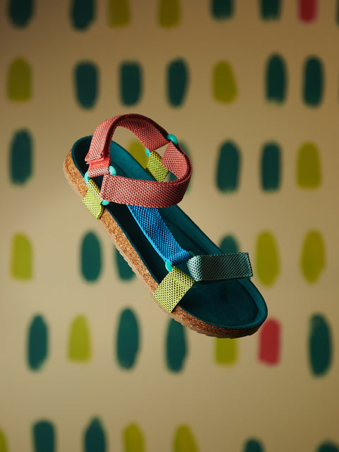 Colorful sandal on a patterned background