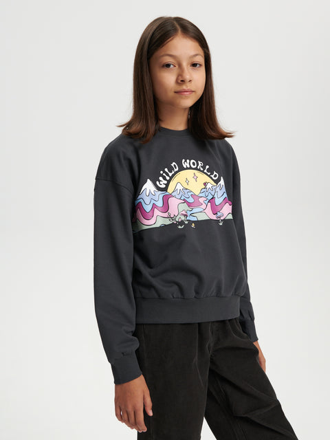 Person wearing a black sweatshirt with a colorful graphic design on a white background