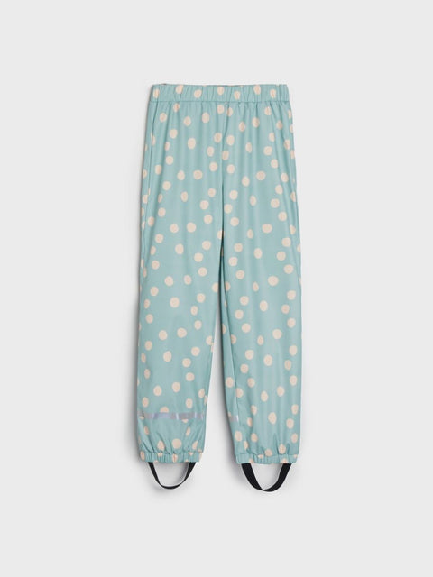 Light blue pants with white polka dots on a white background