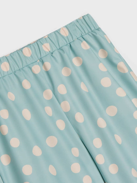 Light blue fabric with beige polka dots on a white background