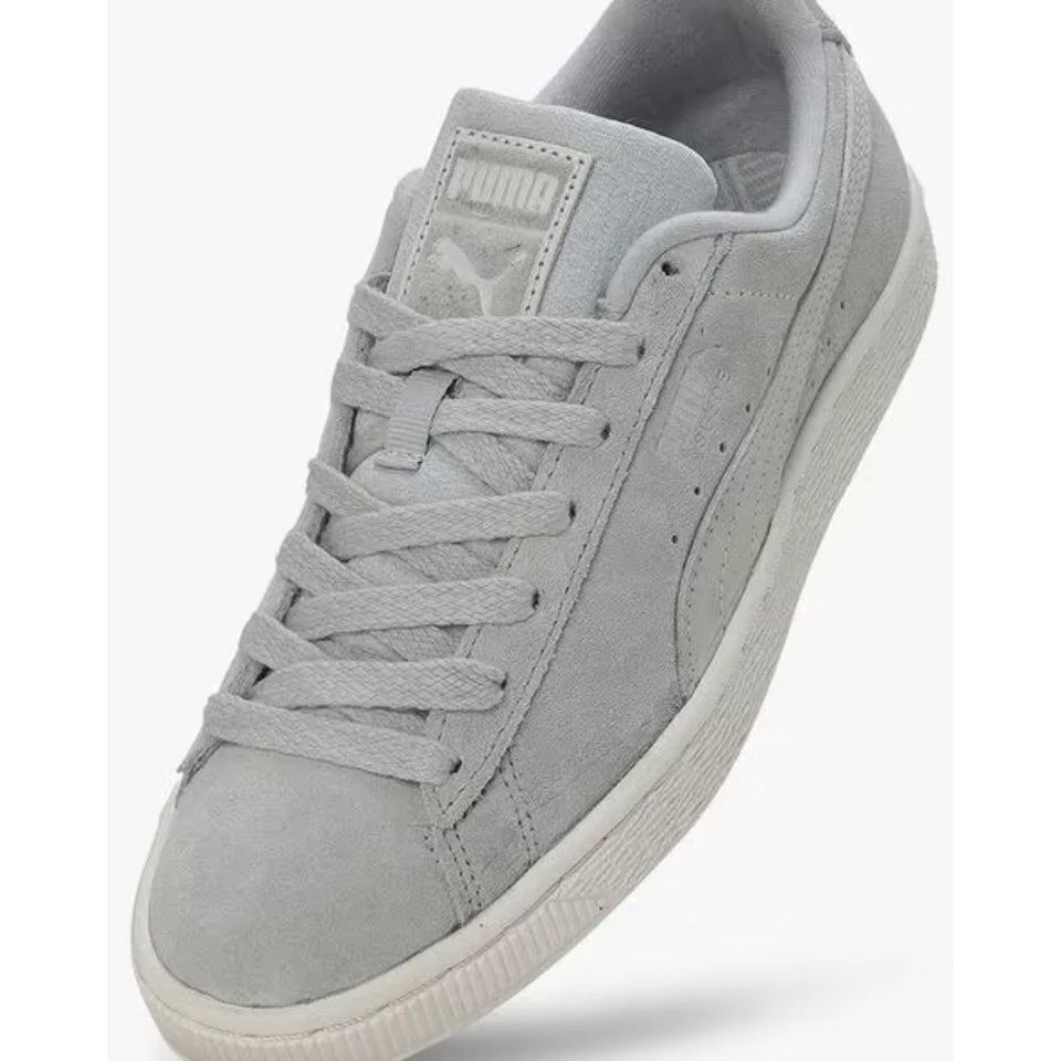 A light gray suede Puma Suede sneaker shown at an angle against a white background.