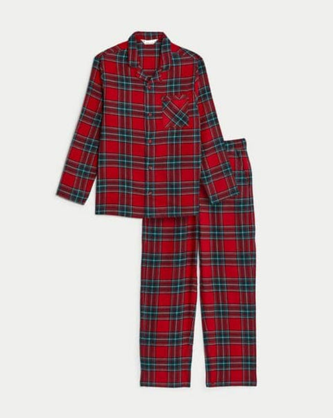 Red and green plaid pajama set on a white background