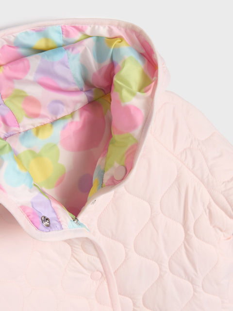 Pastel floral quilt with pink border on a white background