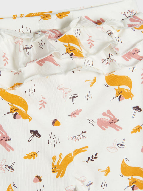 Fabric with animal pattern including foxes, deer, and mushrooms on a white background