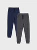 Navy and gray jogger pants on a light gray background