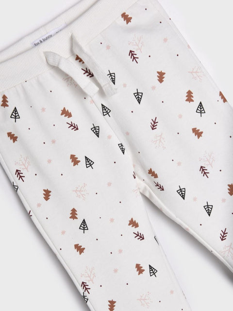 Folded fabric with nature-themed pattern on a white background