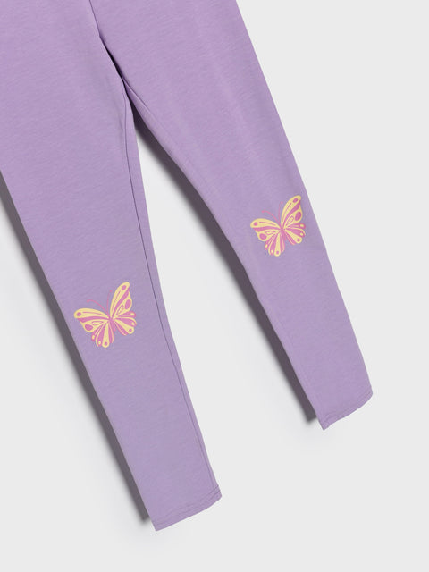 Purple leggings with butterfly designs on a white background