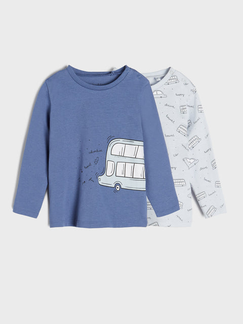 Blue long-sleeve shirt with bus design and white bib on a light gray background