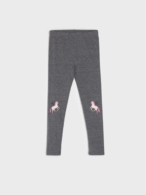 Gray leggings with unicorn designs on a white background