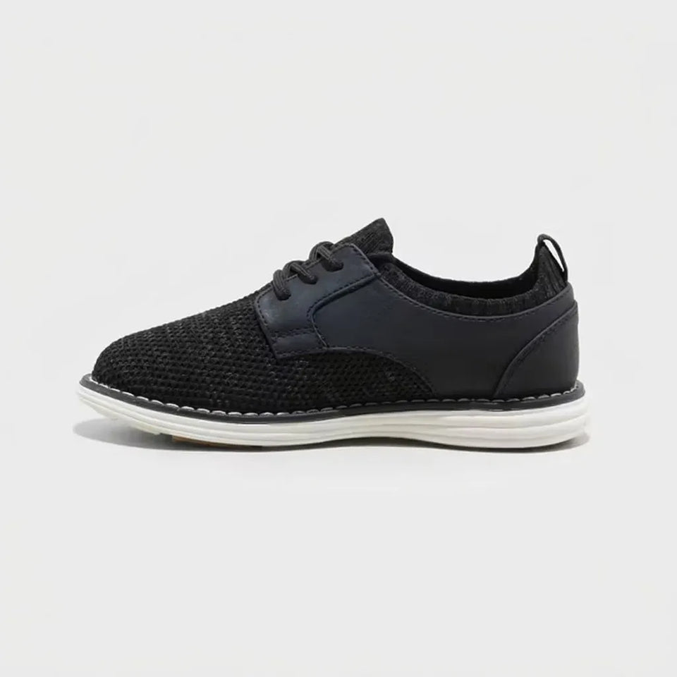 A black knit and leather lace-up sneaker with a white sole, shown in a side profile on a light gray background.
