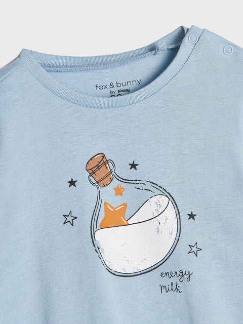 Light blue t-shirt with a bottle graphic and 'energy milk' text, brand 'fox & bunny' visible.