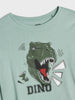 Light green t-shirt with dinosaur graphic and 'DINO' text on a white background