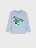 Light blue long-sleeve shirt with green velociraptor graphic on a white background