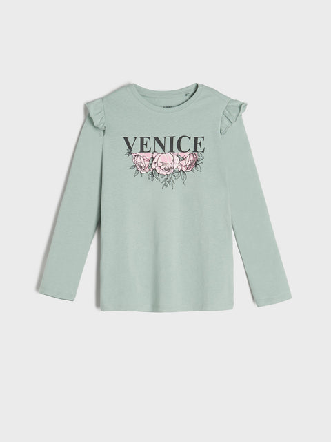 Light green long-sleeve top with 'Venice' and floral design on a white background