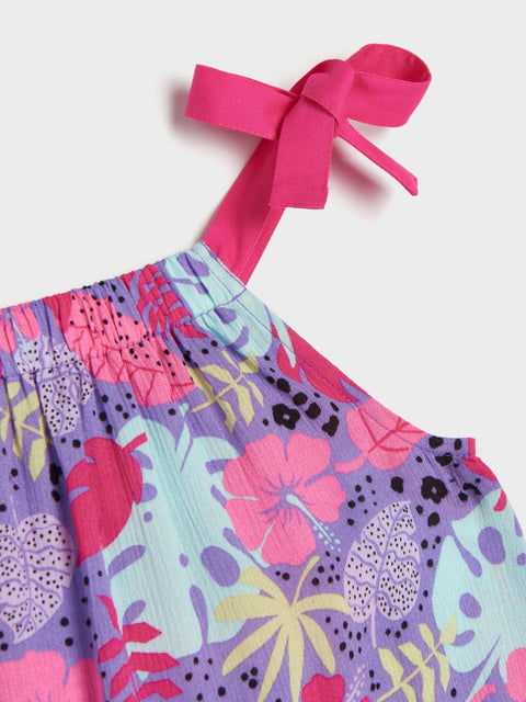 Colorful floral dress with pink straps on a white background