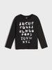 Black long-sleeve shirt with white alphabet letters on a light gray background
