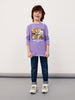 Child wearing a purple shirt with a graphic design on a plain background