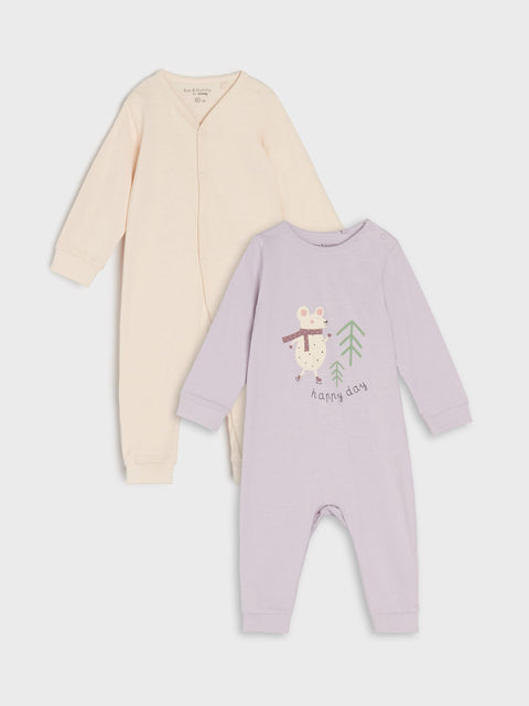 Two baby rompers, one beige and one purple with a owl design, on a light gray background.