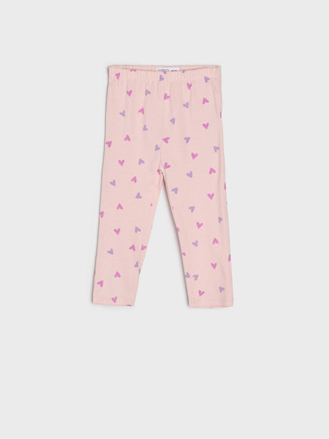 Pink leggings with heart pattern on a white background