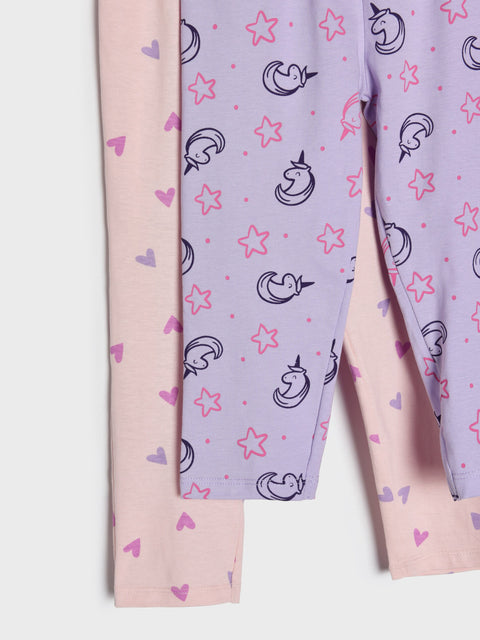 Two pairs of pajama pants with different patterns on a white background