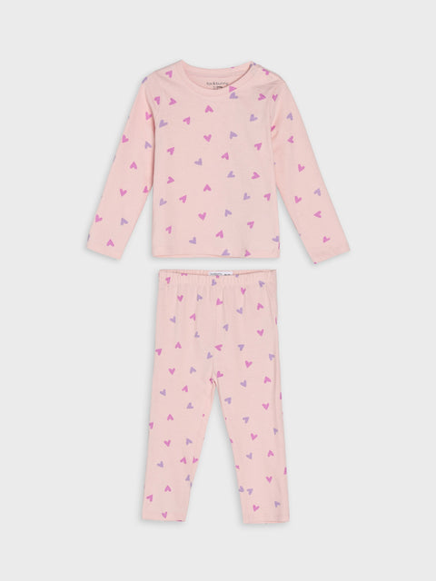Pink children's pajama set with heart patterns on a white background