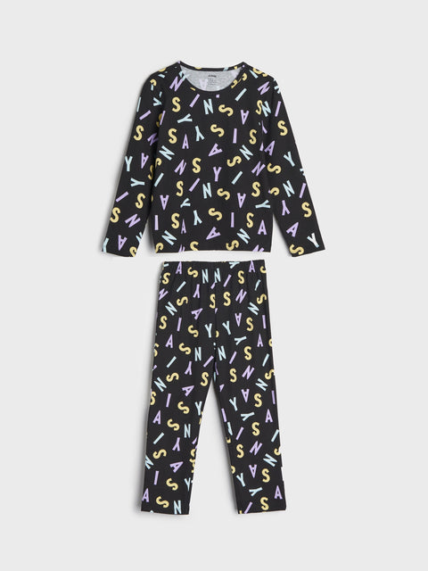 Children's pajama set with colorful letter pattern on a white background