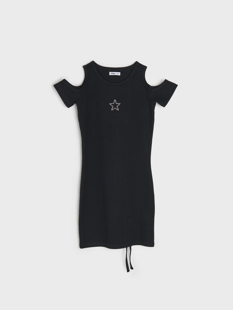 Black dress with star detail on a white background