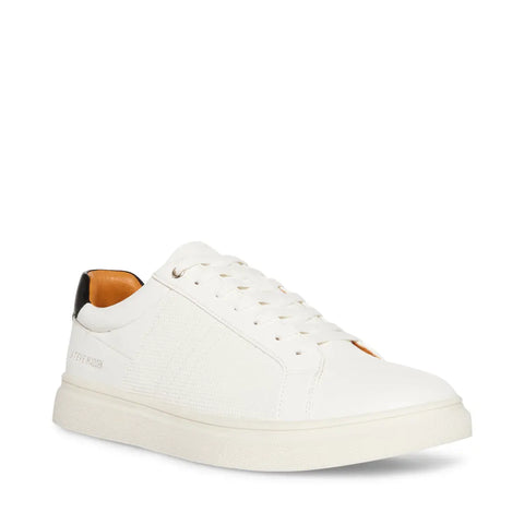 White sneaker with brown insole on a white background