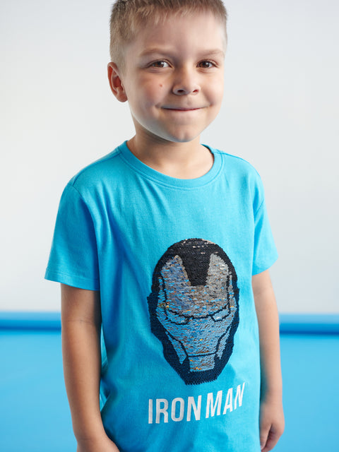 Child wearing a blue 'Iron Man' t-shirt with a sequin design.
