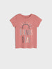 Pink t-shirt with 'Buenos Dias' text on a light gray background