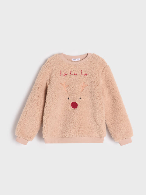 Beige fleece sweater with a reindeer face and 'lalala' text on a light gray background