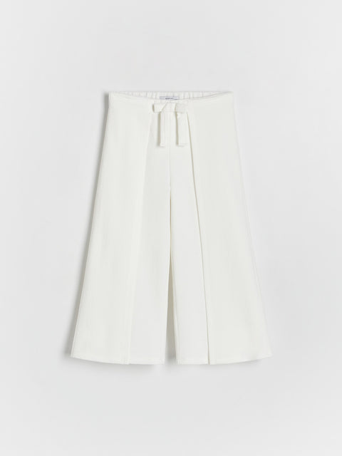 White skirt with a tie waist on a white background