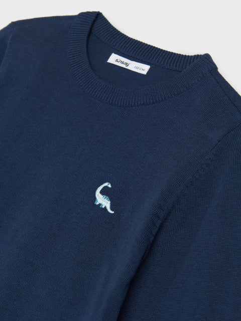 Navy blue sweater with a small white logo on a light gray background