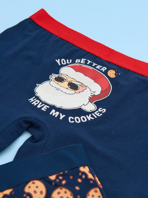 Navy shorts with a Santa Claus graphic and text 'You better have my cookies' on a light blue background.