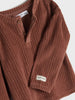 Brown ribbed sweater with 'Nature' label on a white background