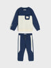 Children's navy and white long-sleeve top and pants set on a light gray background