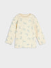 Yellow long-sleeve shirt with blue animal pattern on a light gray background