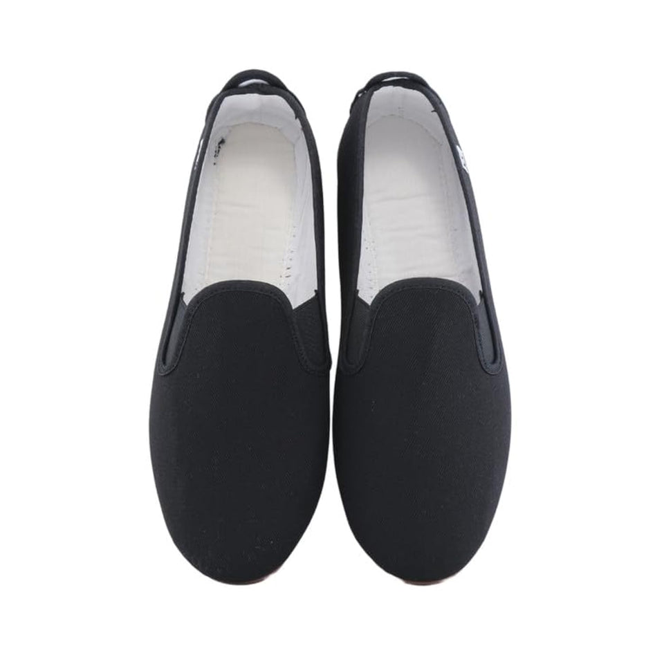 Pair of black loafers on a white background
