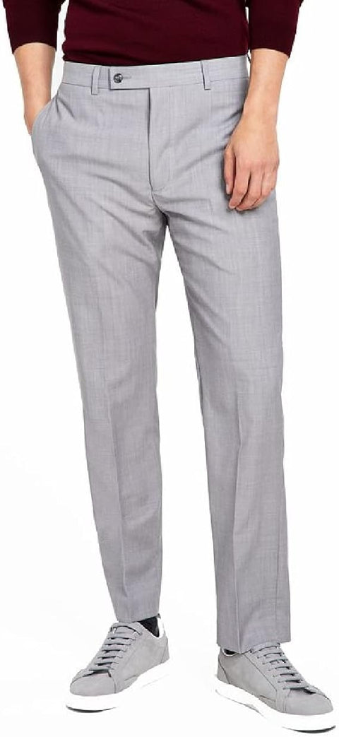 Light gray pants worn by a person on a white background