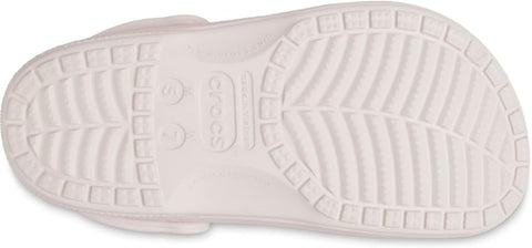 Close-up of white Crocs shoes with sole texture on a white background