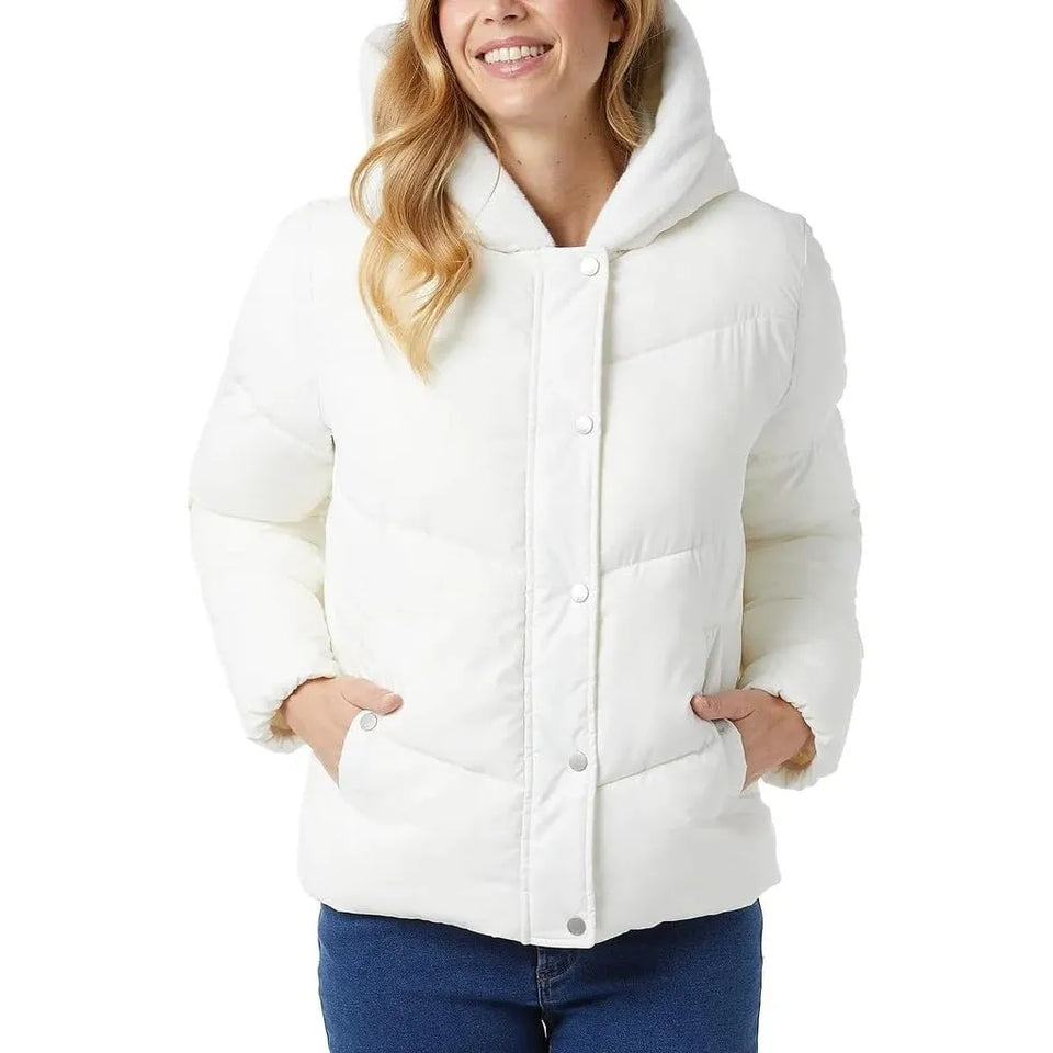 A woman wearing a white hooded puffer jacket with a button-front closure and front pockets, paired with blue jeans, against a plain white background.