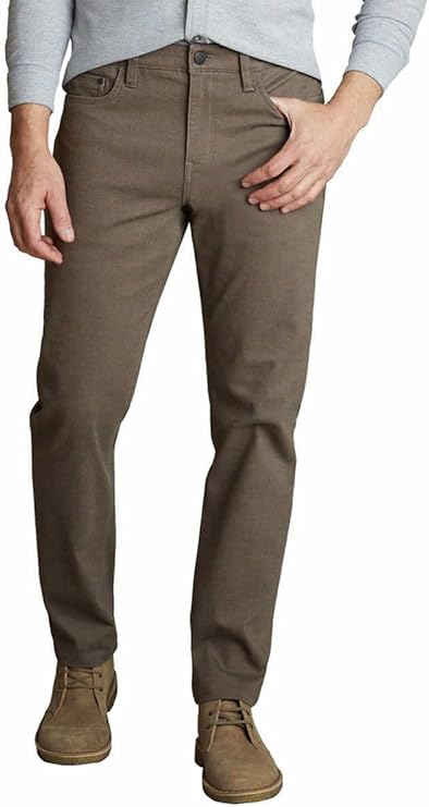 Brown pants worn by a person on a white background