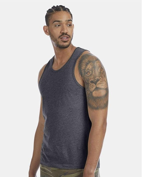 Man wearing a dark gray tank top with a lion tattoo on his arm against a white background