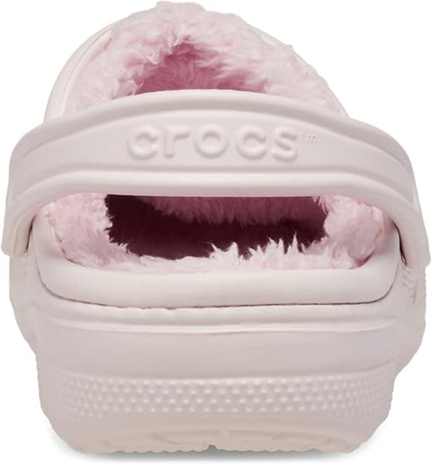 Pink Crocs clog with fluffy interior on a white background