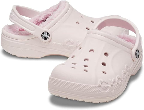 Pair of light pink clogs with fuzzy lining on a white background
